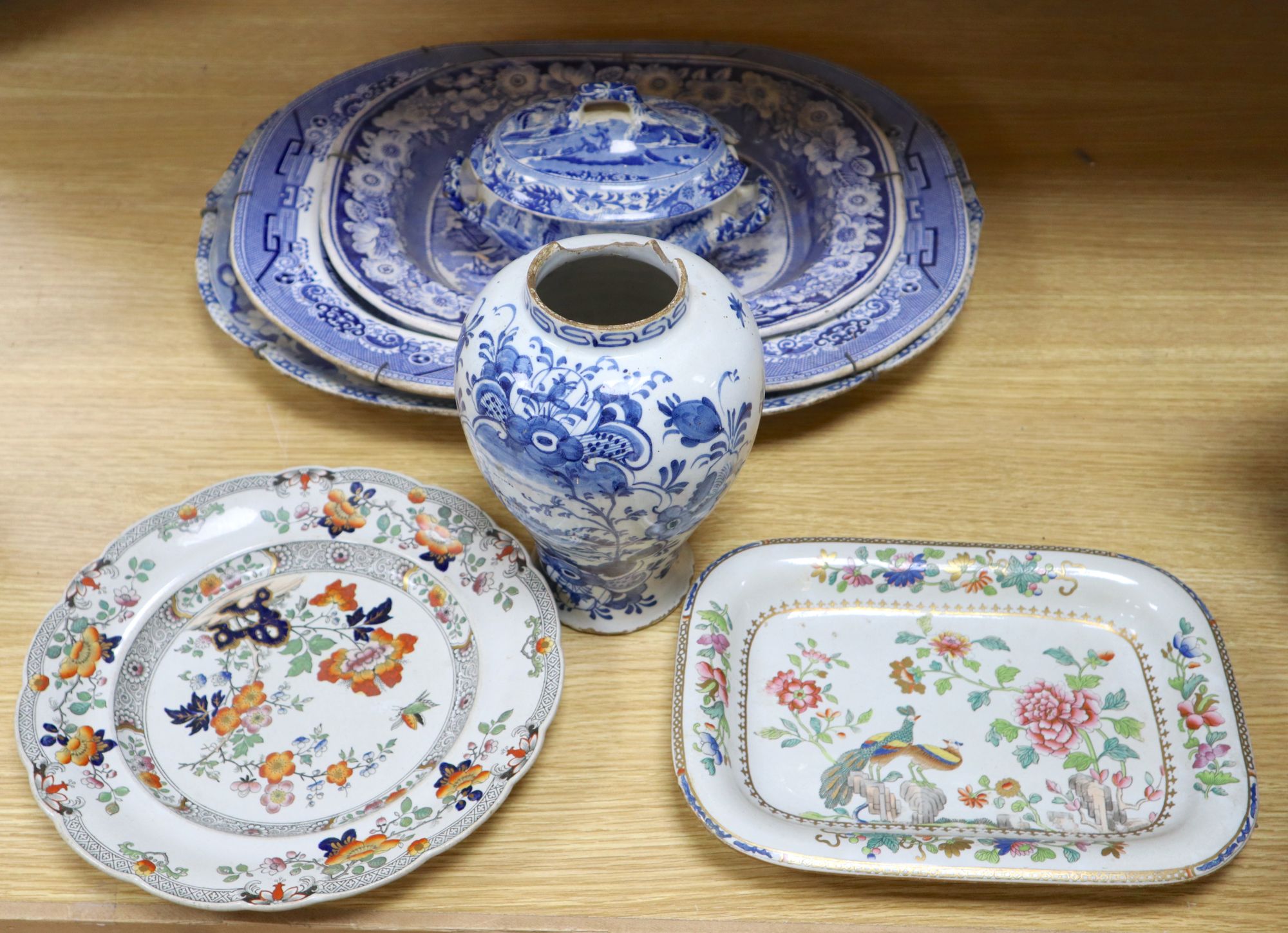 Three blue and white meat platters, largest 49cm wide, two ironstone plates and a tureen and a Delft vase